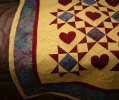 Some of my quilting detail...I traced heart patterns onto the fabric