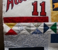 I decided to make and quilt the individual squares, then piece it all together.
