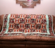 This quilt incorporated some southwestern type fabrics and resides in our living room during the winter months.